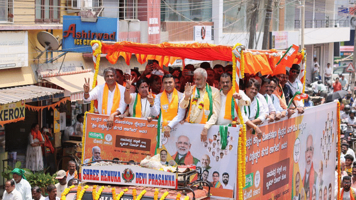 Goa CM Pramod Sawant (centre) campaigns for BJP candidate Vishweshwar Hegde Kageri (in garland) in Uttara Kannada | Pic credit: X/@DrPramodPSawant