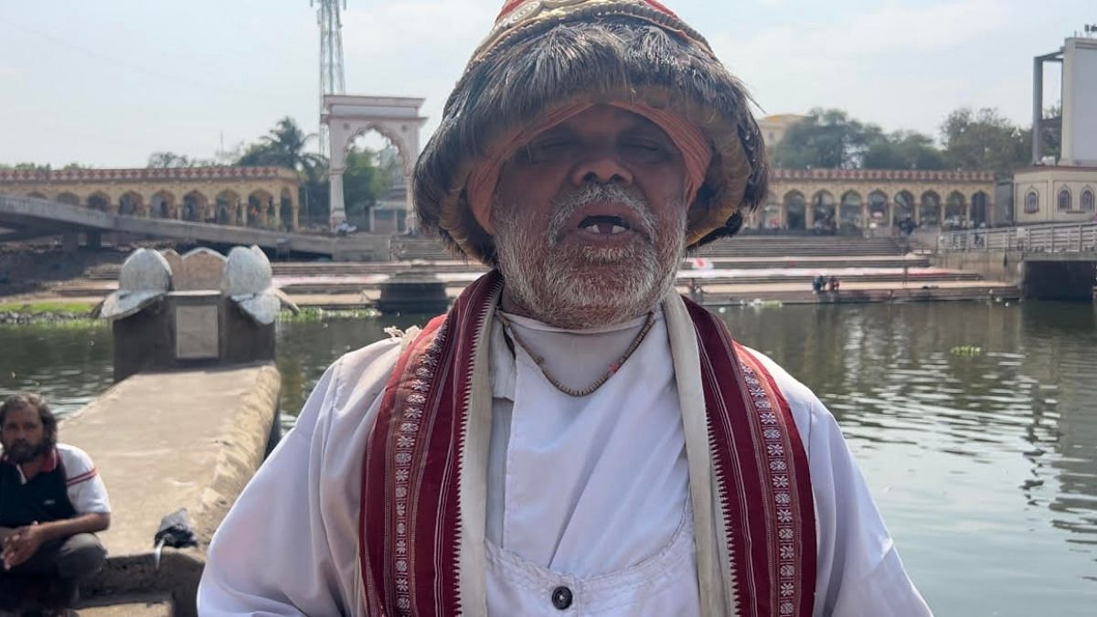 Vasudev Sambhaji Gawli standing on the steps of the Indrayani bank | Manasi Phadke, ThePrint