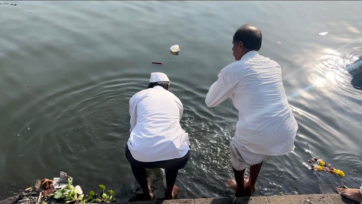 Devotees washing their hands and feet, and drinking a sip of the polluted Indrayani waters as holy water | Manasi Phadke, ThePrint