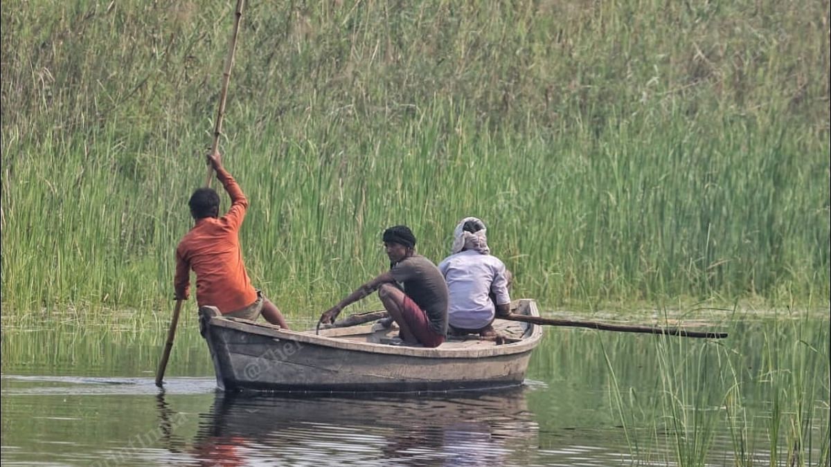 Villagers cross the Girwa river on a boat | Praveen Jain | ThePrint