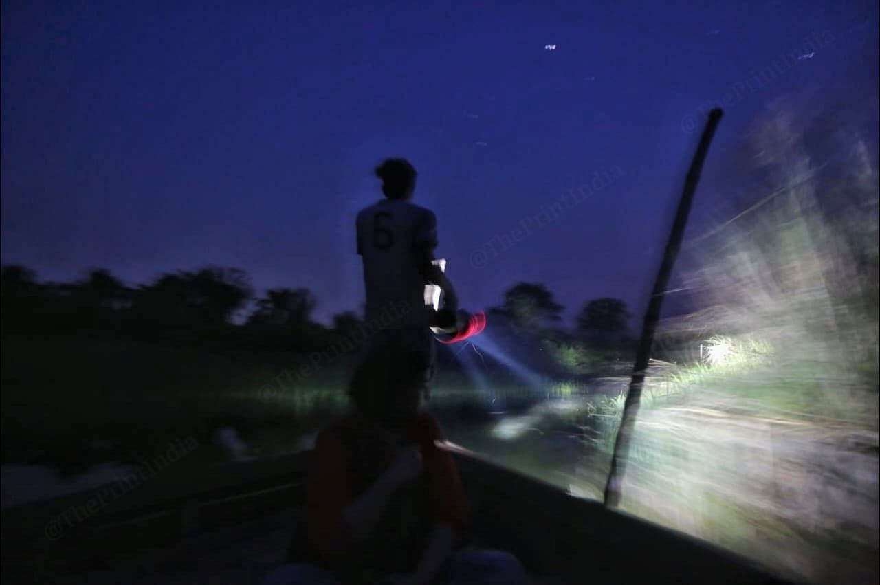 The boat traversing through the treacherous crocodile-infested waters of the Girwa river at night. This route connects Bharthapur to India | Photo: Praveen Jain | ThePrint