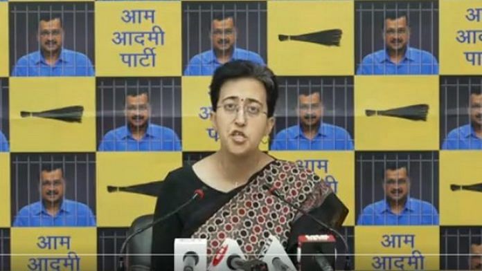 AAP leader Atishi during a press interaction. Imagery representing Kejriwal behind bars is currently a mainstay of AAP media conferences 