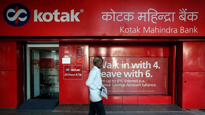 A man walks past the Kotak Mahindra Bank branch in New Delhi, India | Reuters file photo