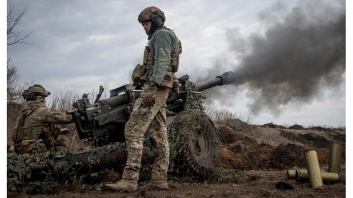 File photo of Ukrainian service members firing a howitzer at a front line near the city of Bakhmut | Reuters