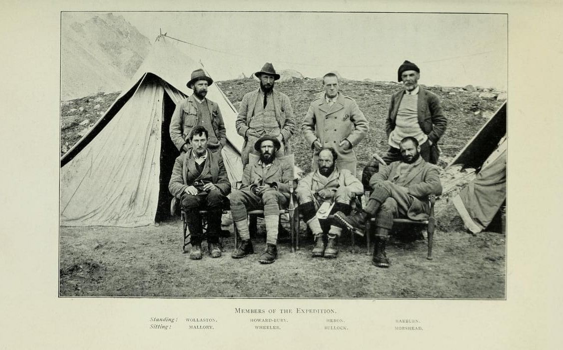 1921 Mount Everest reconnaissance expedition team members. Taken at 17,300 advanced base camp. Mallory sitting on left. Published in Howard-Bury, C. K. (1922) | Source: Wikimedia Commons