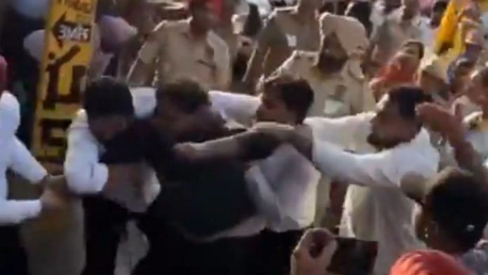Screenshot of man being dragged from Chief Minister Bhagwant Mann’s roadshow | Video: ‘X’/@bsmajithia