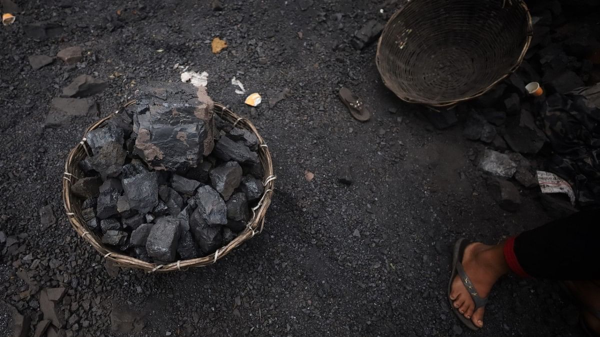 Coal being collected at a mine | Manisha Mondal | ThePrint