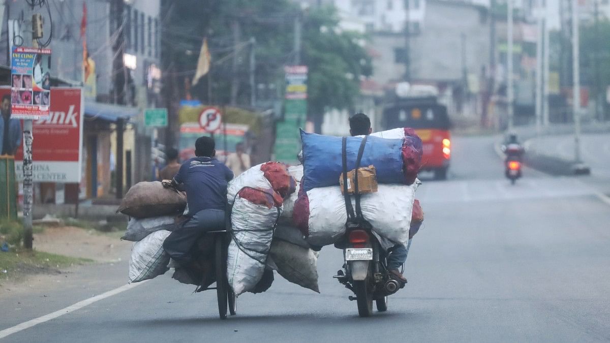 Motorcycle riders carrying coal-filled gunny bags | Manisha Mondal | ThePrint