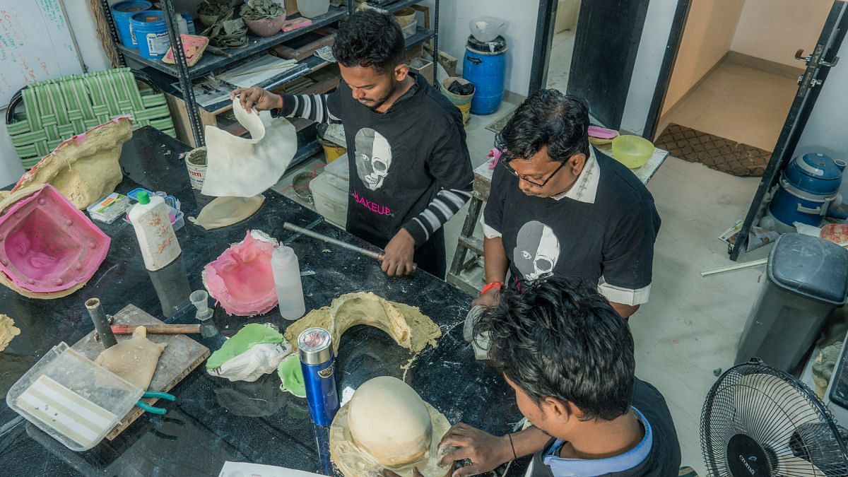 Members of the Da Makeup lab at making prosthetic elements | Credit: Da Makeup Lab