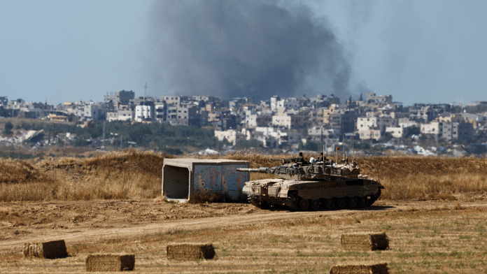 An Israeli tank holds a position as smoke rises in Gaza, amid the ongoing conflict between Israel and the Palestinian Islamist group Hamas, near the Israel-Gaza border, in Israel, 15 May, 2024 | File Photo | Reuters/Amir Cohen