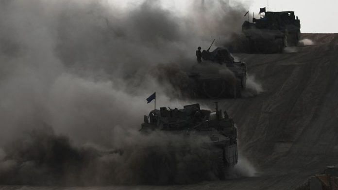 Israeli armoured personnel carriers (APC) operate, amid the ongoing conflict between Israel and the Palestinian Islamist group Hamas, near Israel's border with Gaza in southern Israel, May 29, 2024. REUTERS/Ronen Zvulun