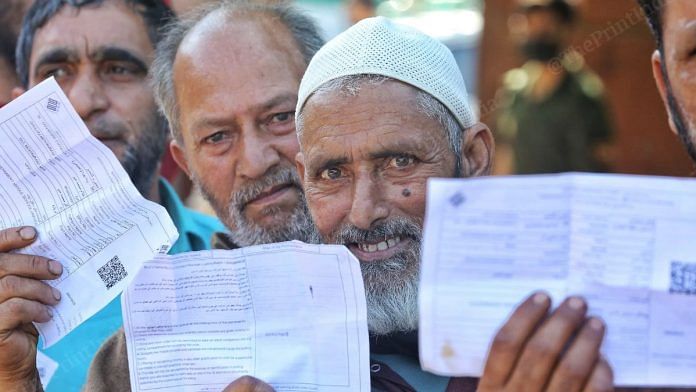 Voters show their voting slip in Urpora ahead of voting | Praveen Jain | ThePrint