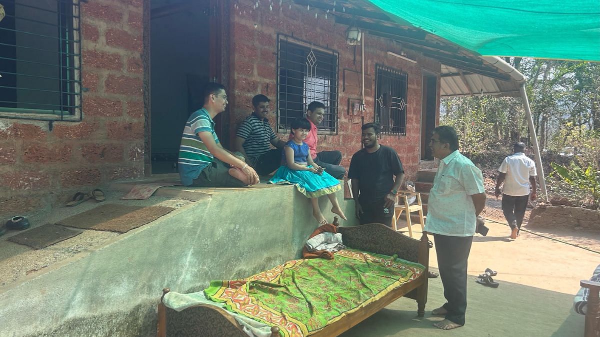 Vinay Natu with residents of the Makhajan village | Manasi Phadke | ThePrint