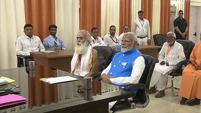 PM Narendra Modi with Ganeshwar Shastri Dravid as he filed his nomination papers Tuesday | ANI