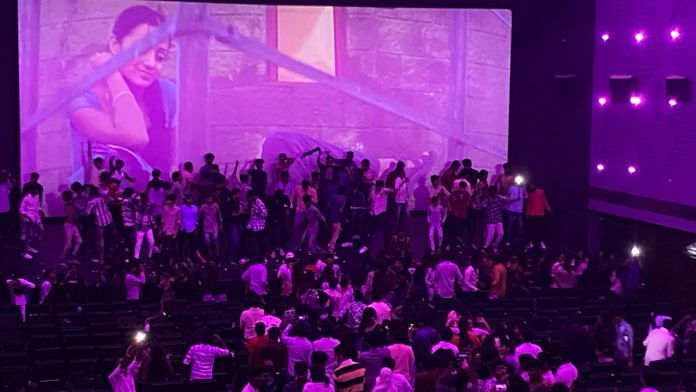 Crowd dancing in front of movie screen in Chennai | Prabhakar Thamilarasu, ThePrint