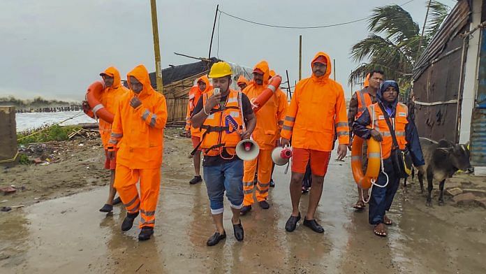 NDRF and Block Disaster Management personnel make announcements as part of precautionary measures, ahead of the landfall of Cyclone 'Remal', in South 24 Parganas district, Sunday, May 26, 2024 | PTI