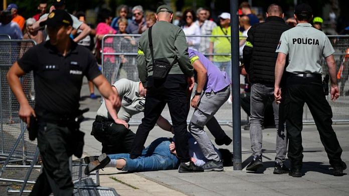 A person is detained after a shooting incident after Slovak government meeting in Handlova, Slovakia, May 15, 2024. REUTERS/Radovan Stoklasa