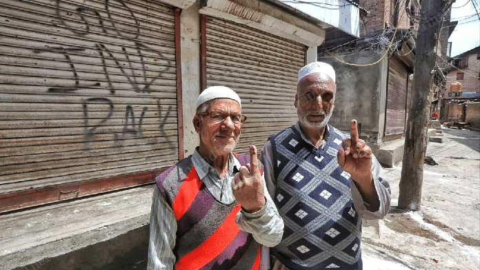 Mehrajuddin (right) after casting his vote at K.K. Mohalla in Srinagar's Zaina Kadal | Praveen Jain | ThePrint