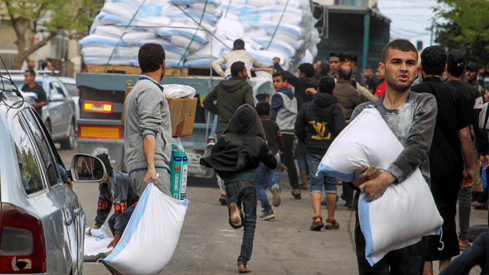 Palestinian civilians headed out of sodden tented camps or family homes in Rafah | Reuters