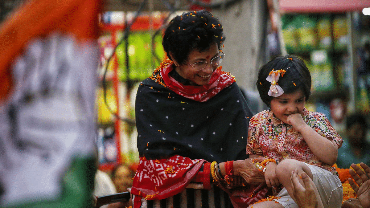 Congress candidate Kumari Selja with a child during an election campaign in Sirsa | Manisha Mondal | ThePrint
