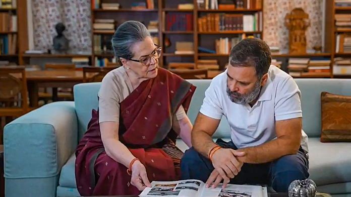 Sonia Gandhi and Rahul Gandhi look at album of the Gandhi family's work in Amethi and Rae Bareli constituencies | PTI