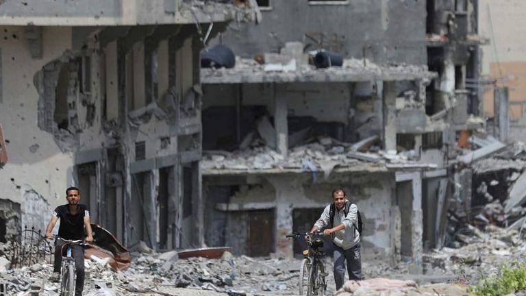 Upsurge in battles across Gaza, Israel shows images of gunmen at UN site
