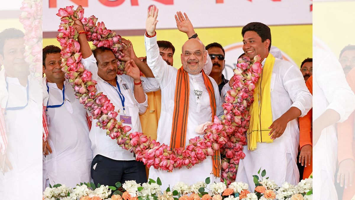 Amit Shah being garlanded during a public rally | ANI