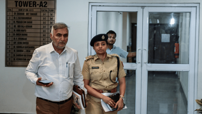 Special CP Pramod Kushwaha and a woman police officer leave the residence of AAP Rajya Sabha MP Swati Maliwal on Thursday | ANI