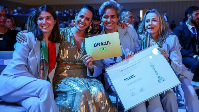 Brazilian representatives celebrate after winning the bid to host the Women's World Cup at the 74th FIFA Congress | Reuters/Athit Perawongmetha