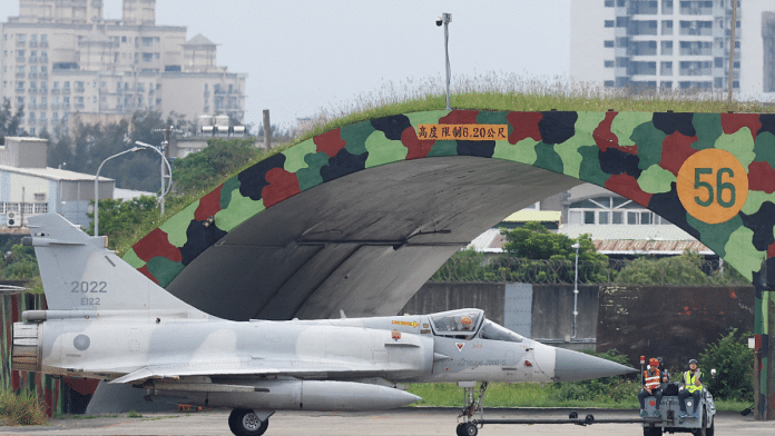 A Taiwan Air Force Mirage 2000-5 aircraft is transported by ground staff at Hsinchu Air Base in Hsinchu, Taiwan May 23, 2024. Reuters | Carlos Garcia Rawlins