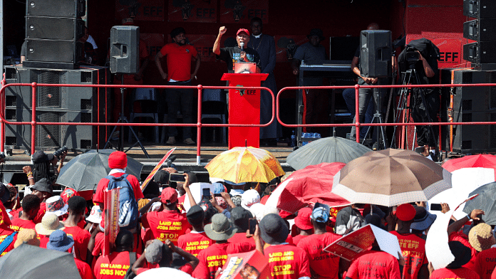 Julius Malema, leader of the South African opposition party the Economic Freedom Fighters (EFF), addresses the crowd during the Workers Day community meeting | Reuters | File Photo | Alet Pretorius