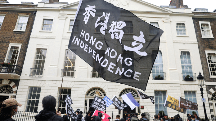 People demonstrate outside the Hong Kong Economic and Trade Office in London, in support of the arrest of three men later charged with assisting Hong Kong's foreign intelligence service in Britain. Picture taken on 14 May, 2024 | Reuters  