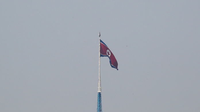 A North Korean flag flutters on top of the 160-metre tall tower at North Korea's propaganda village of Gijungdong | Reuters/Kim Hong-Ji