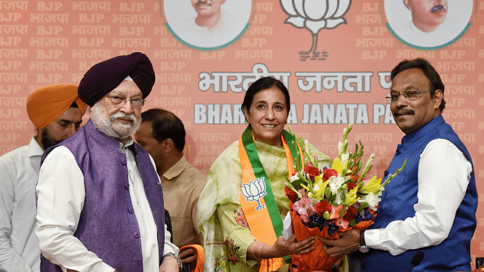 Union minister Hardeep Singh Puri and BJP general secretary Vinod Tawde welcome former IAS officer Parampal Kaur Sidhu after she joined BJP | ANI