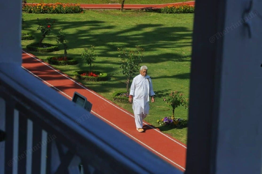 ThePrint visited his official residence, the Raj Bhawan, nestled among lush green patches of land, with hills and a lake in the backdrop, to capture glimpses of Sinha’s day through pictures | Praveen Jain | ThePrint