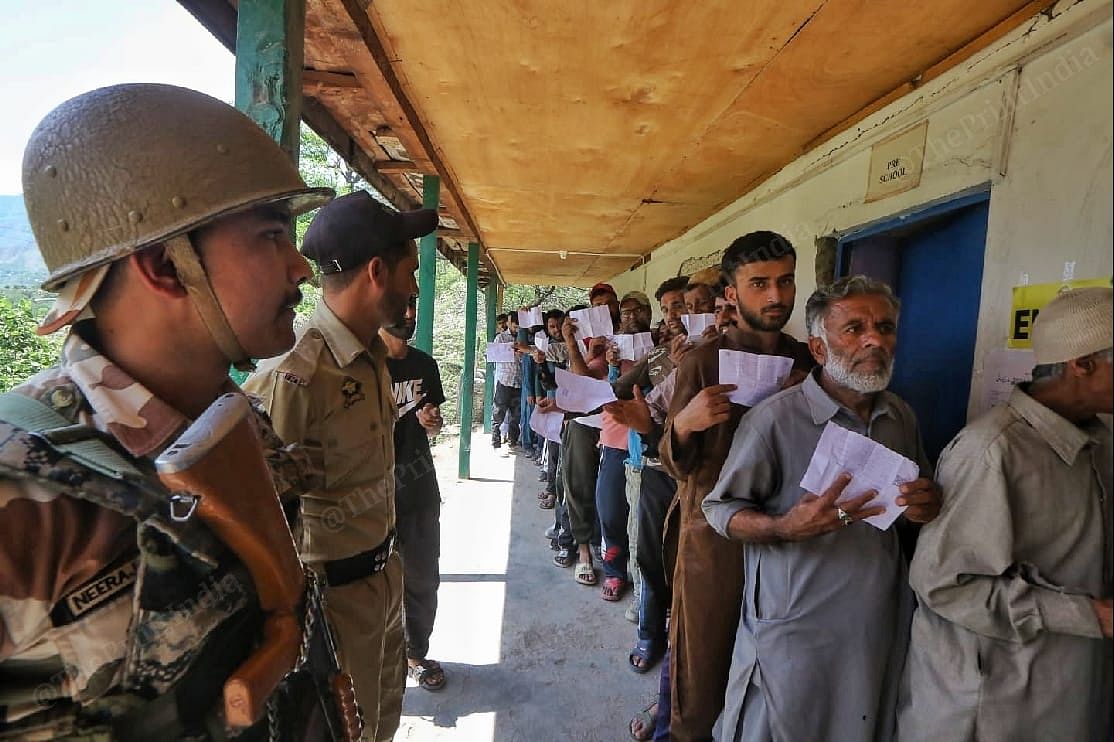 Voters queuing up to cast their ballots at a polling station in Baramulla parliamentary constituency | Praveen Jain | ThePrint