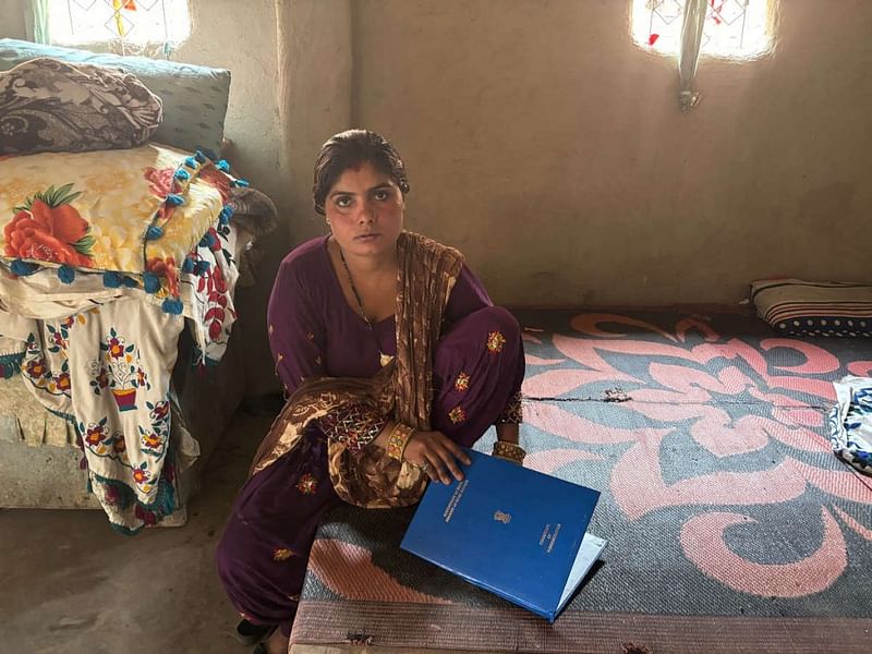 Yashoda sits at her house in Majnu Ka Tila with her new citizenship certificate | Bismee Taskin | ThePrint
