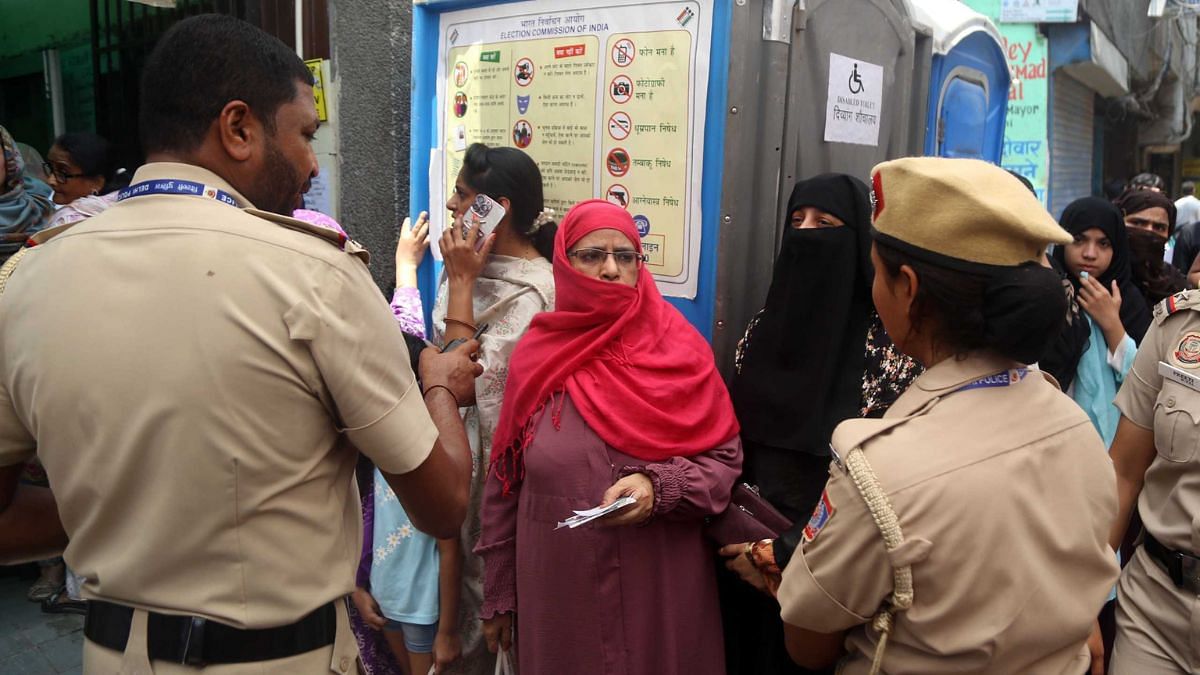 Police outside a voting booth in Anantnag | Photo: Praveen Jain, ThePrint