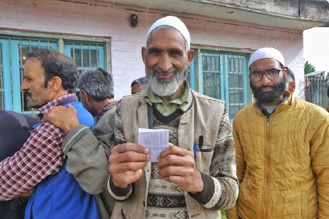 A voter holding his voting receipt | Praveen Jain | ThePrint