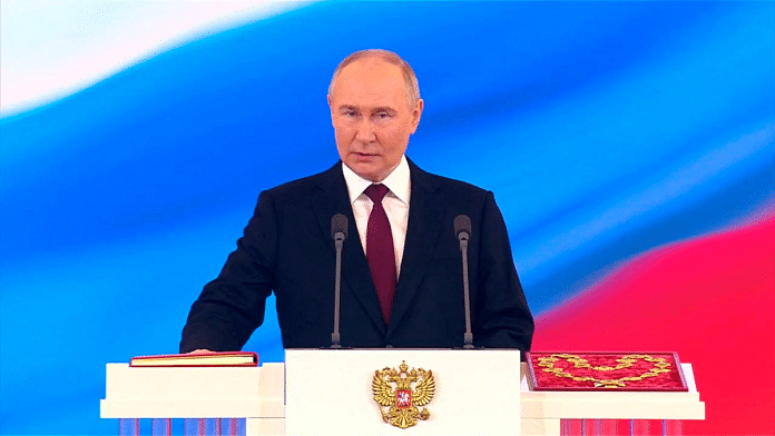Russian President Vladimir Putin takes the oath during an inauguration ceremony at the Kremlin in Moscow, Russia May 7, 2024, in this still image taken from live broadcast video | Kremlin.ru/Handout via Reuters