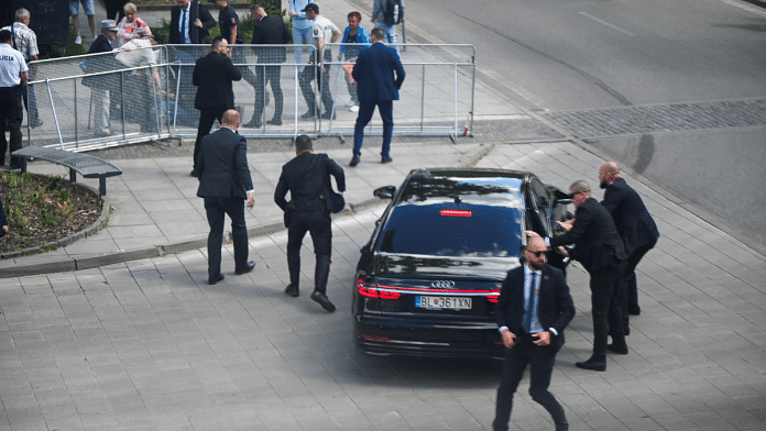 Security guards react at the scene of a shooting incident of Slovak PM Robert Fico after Slovak government meeting in Handlova, Slovakia | Reauters/Radovan Stoklasa