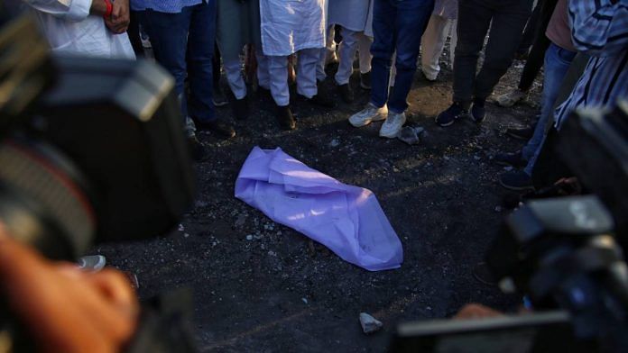 A charred body part found under the debris and covered with a white cloth after the fire at TRP Gaming Zone | Manisha Mondal | ThePrint