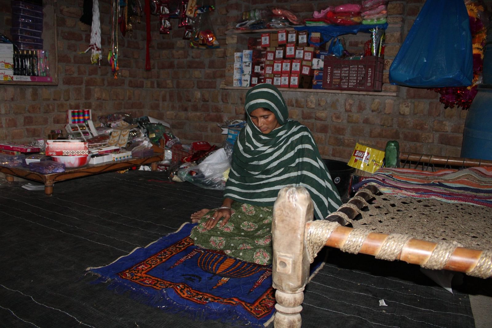 Sajida offrering Namaz in her newly opened shop. Photo | Heena Fatima | ThePrint