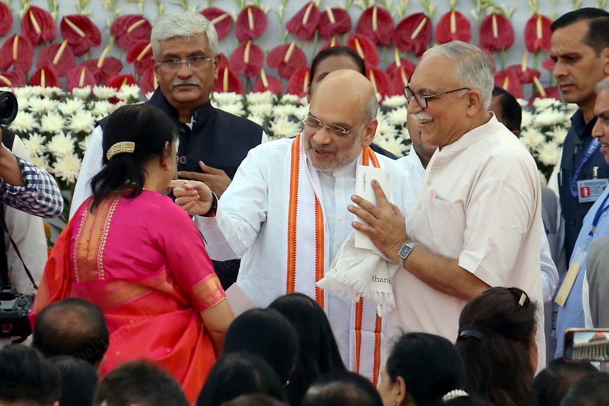 Home Minister Amit Shah with his wife during a swearing-in ceremony | Praveen Jain | ThePrint