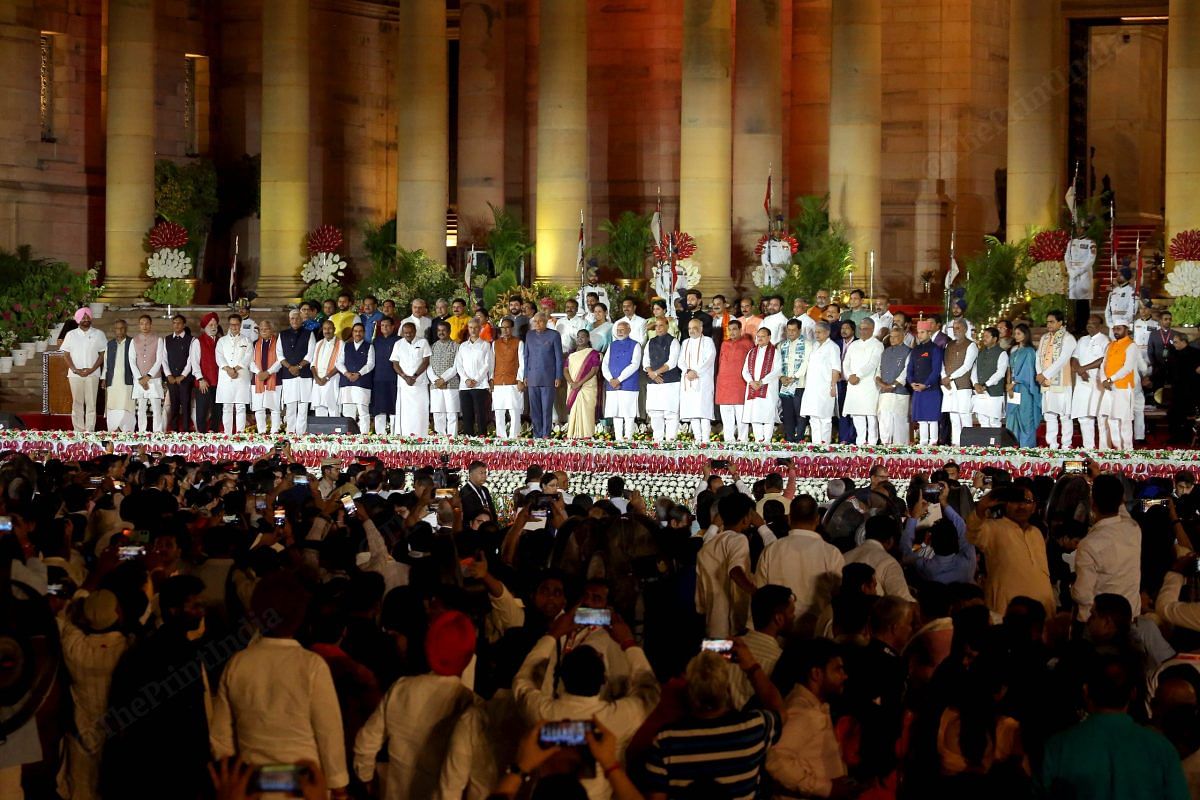 India's newly sworn-in Prime Minister Narendra Modi during a group picture with other newly appointed Council of Ministers at Rashtrapati Bhavan | Praveen Jain | ThePrint