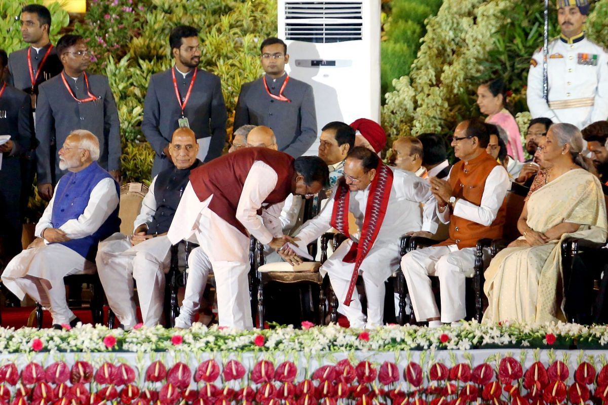 Harsh Malhotra touching BJP National President J.P Nadda | Praveen Jain | ThePrint