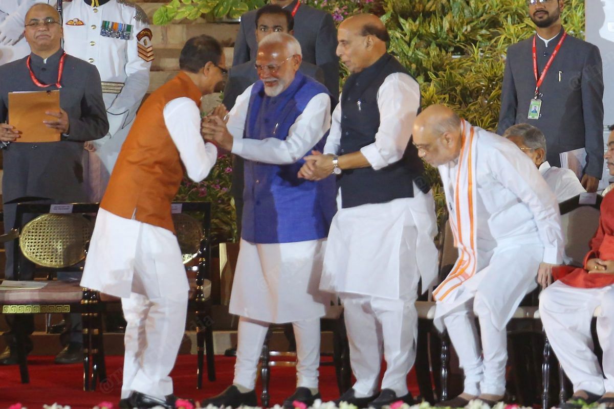 PM Modi, Defence Minister Rajnath Singh, and Home Minister Amit Shah congratulates Shivraj Singh Chouhan after his oath | Praveen Jain | ThePrint