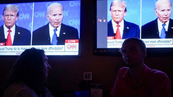Spectators watching debate between Joe Biden and Donald Trump at Union Pub on Capitol Hill in Washington, Thursday | Reuters/Nathan Howard