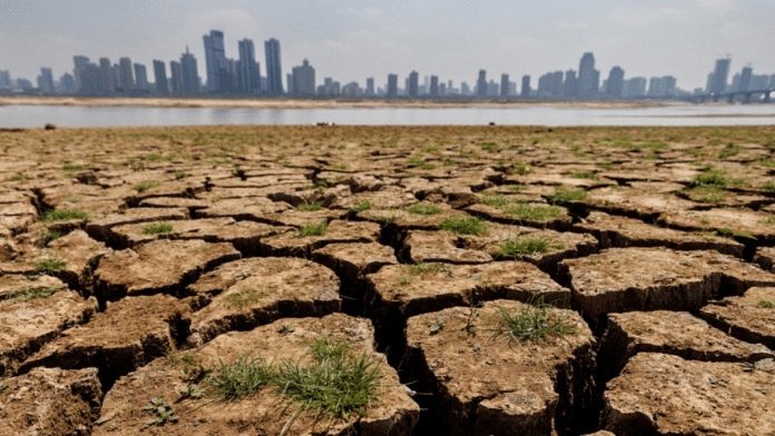 Cracks run through the partially dried-up river bed of the Gan River during a regional drought in Nanchang, Jiangxi province, China, 28 August, 2022 | Representational image | REUTERS/Thomas Peter