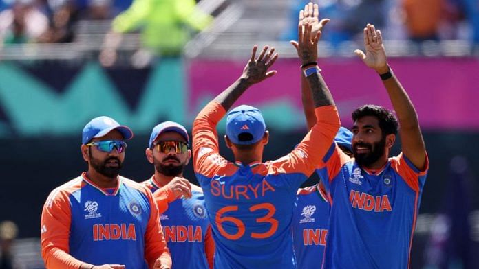 India's Jasprit Bumrah celebrates with team mates after taking the wicket of Pakistan's Babar Azam in ICC T20 World Cup 2024 at Nassau County International Cricket Stadium, New York, United States on 9 June | REUTERS/Andrew Kelly